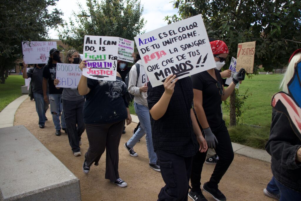Protesters march around the UTRGV Student Union Quad in observance of National Protest Against Police Brutality Day