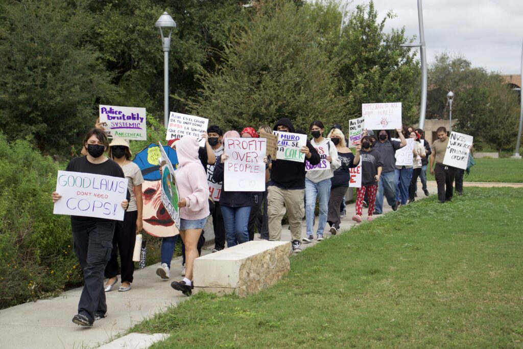 Demonstrators advocate against ICE and police brutality Thursday afternoon at the Student Union Quad on the Edinburg campus.