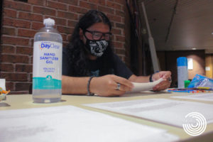 Assistant stage manager for “Tomas and the Library Lady,” Etuan Hurtado, prepares material outside the studio theatre in the ELABS building for students auditioning on Aug. 11, 2021 at the UTRGV Edinburg campus