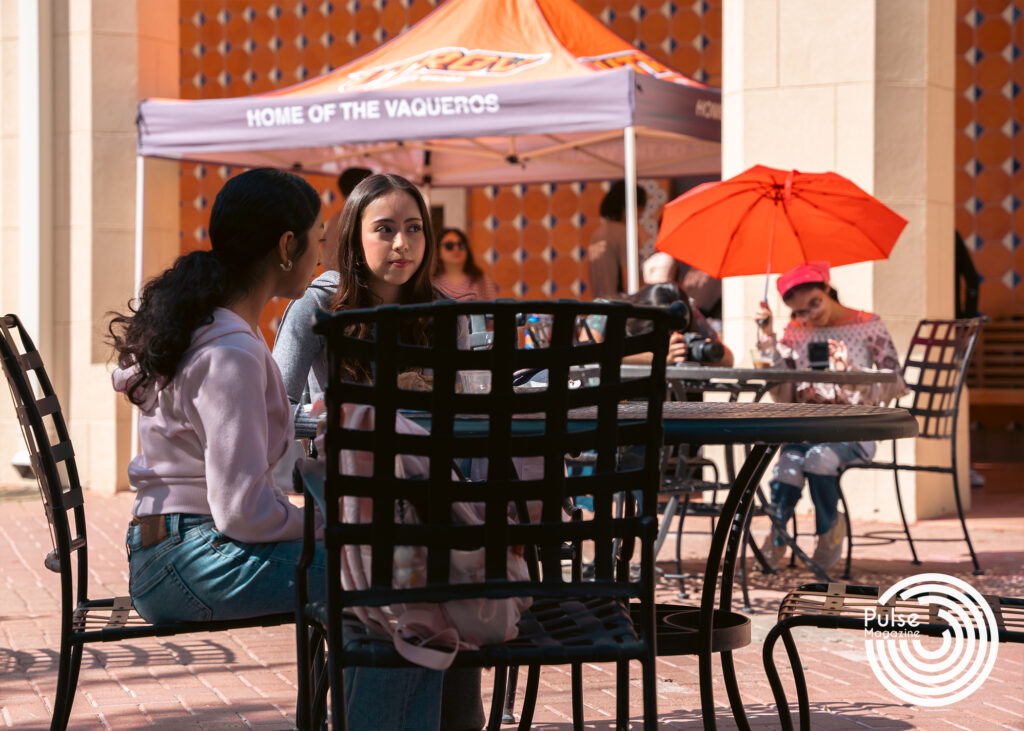 Environmental science freshman Rebeca Garcia (left), sits with nursing freshman Madai Trejo as they eat s’mores and listen to live jazz music being played in front of them Thursday at the Student Union Veranda in Brownsville. Derick Lara/Pulse
