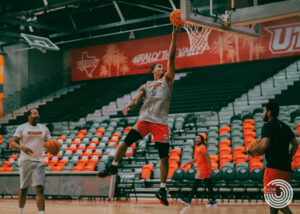 Redshirt junior guard Howie Fleming Jr. soars through the air to finger roll the ball into the basket during practice Nov. 1 at the UTRGV Fieldhouse in Edinburg.