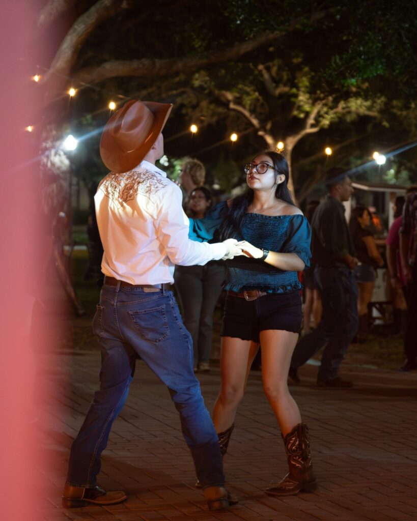 Music education freshman Joel Trevino shares a dance with radiology freshman Daniela Vazquez Wednesday night at the Vaquero Cumbia Fest on the Brownsville campus. Eduardo Rodriguez/Pulse