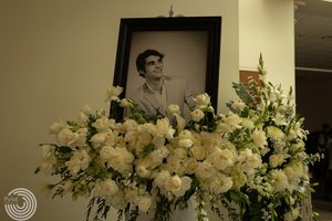 A portrait of actor RJ Mitte with flowers.